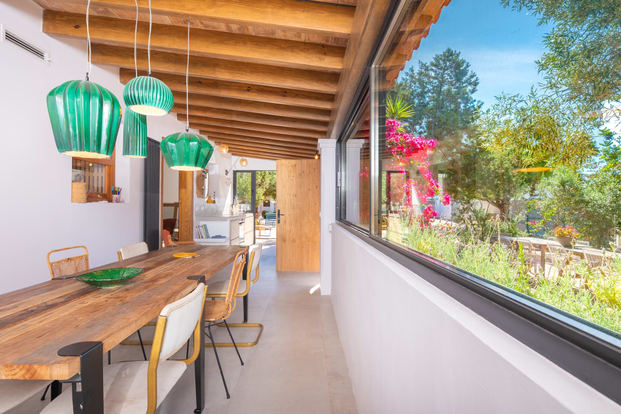 Covered dining terrace with ceramic pendant lights