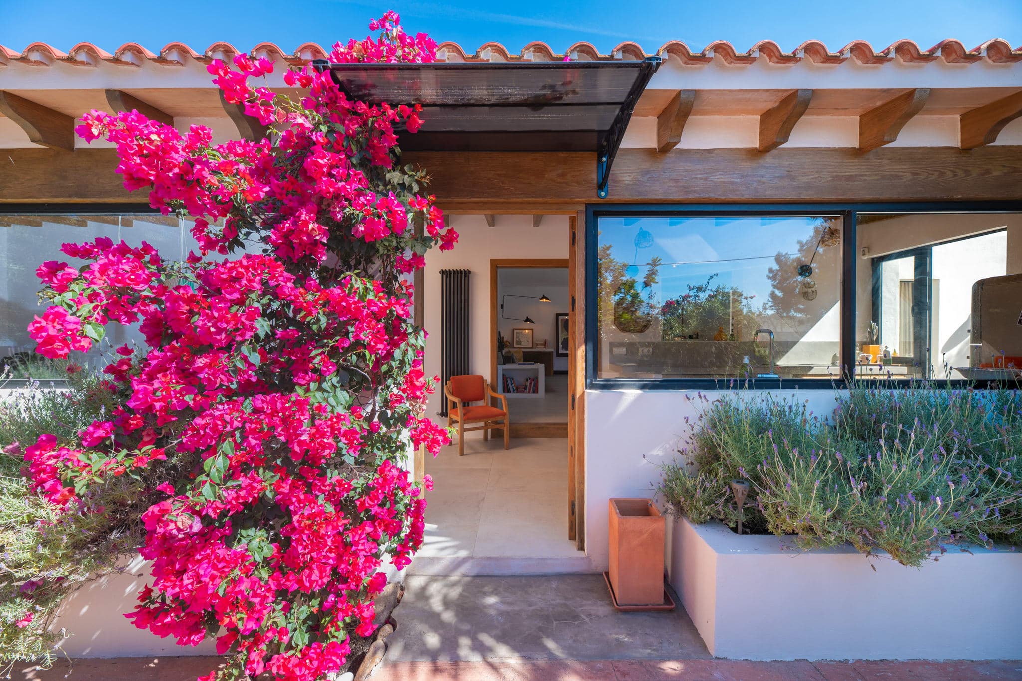 Entrance framed by bougainvillea