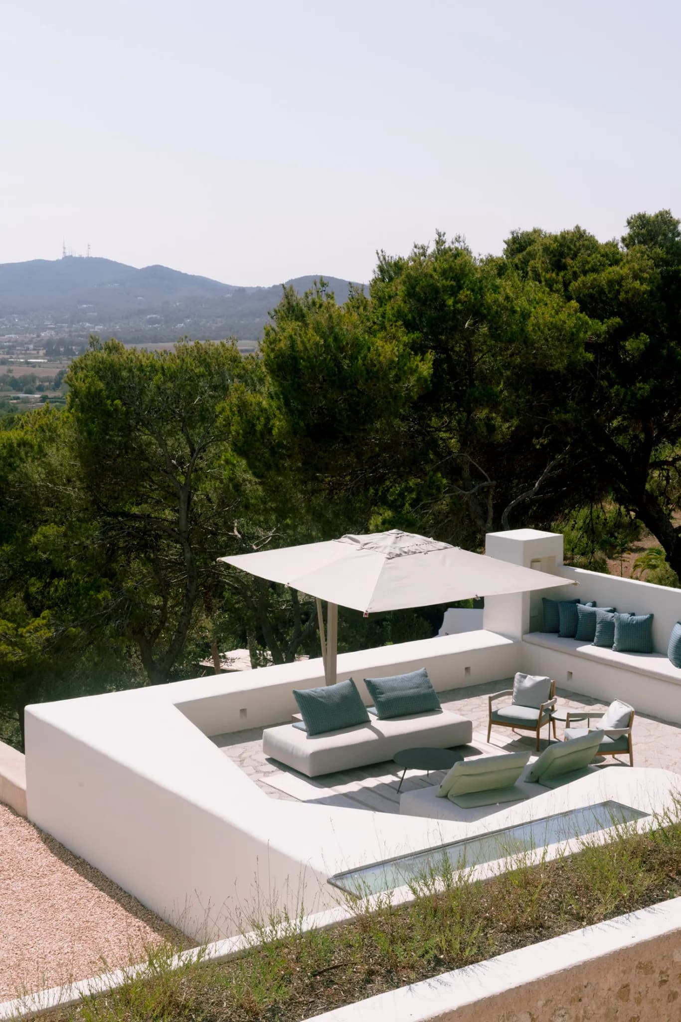 Rooftop lounge with hillside view